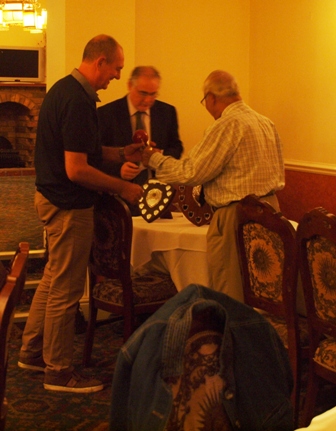 John Gill receives award from Percy Bulsara