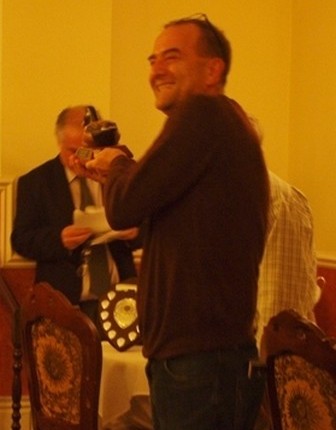 Steve Revett receives award from Percy Bulsara